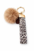 Porte-clés lanière léopard doré – Pompon beige – Style chic & moderne